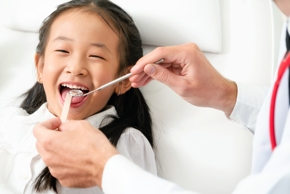 young girl getting a dental checkup
