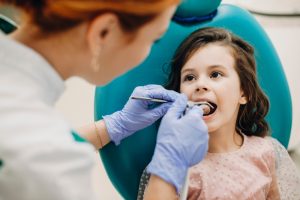 young girl visiting the dentist