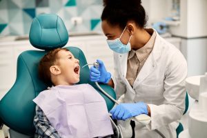 young boy getting a dental checkup