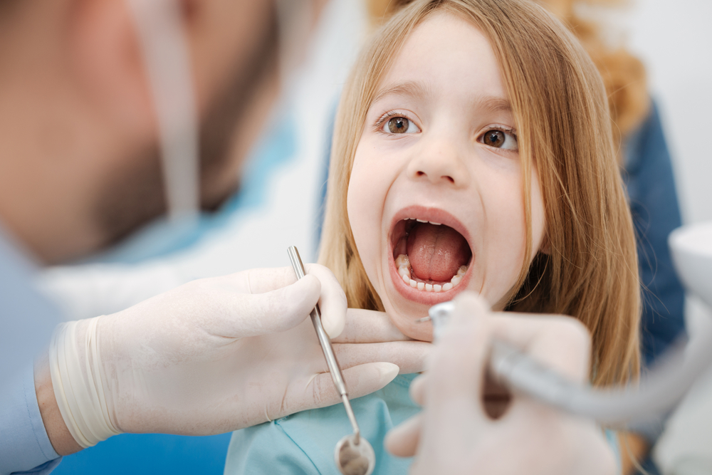 young girl getting a dental checkup