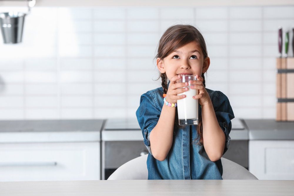 child drinking milk