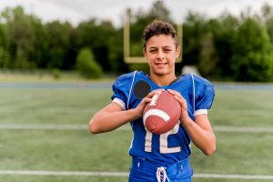 boy playing football